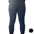 Back view of boy's Pro A7 cut-resistant hockey leggings showing groin, thigh, calf, and Achilles coverage.