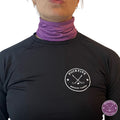 Female hockey player wearing purple Pucktive cut-resistant neck guard.