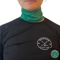 Female hockey player wearing green Pucktive cut-resistant neck guard.