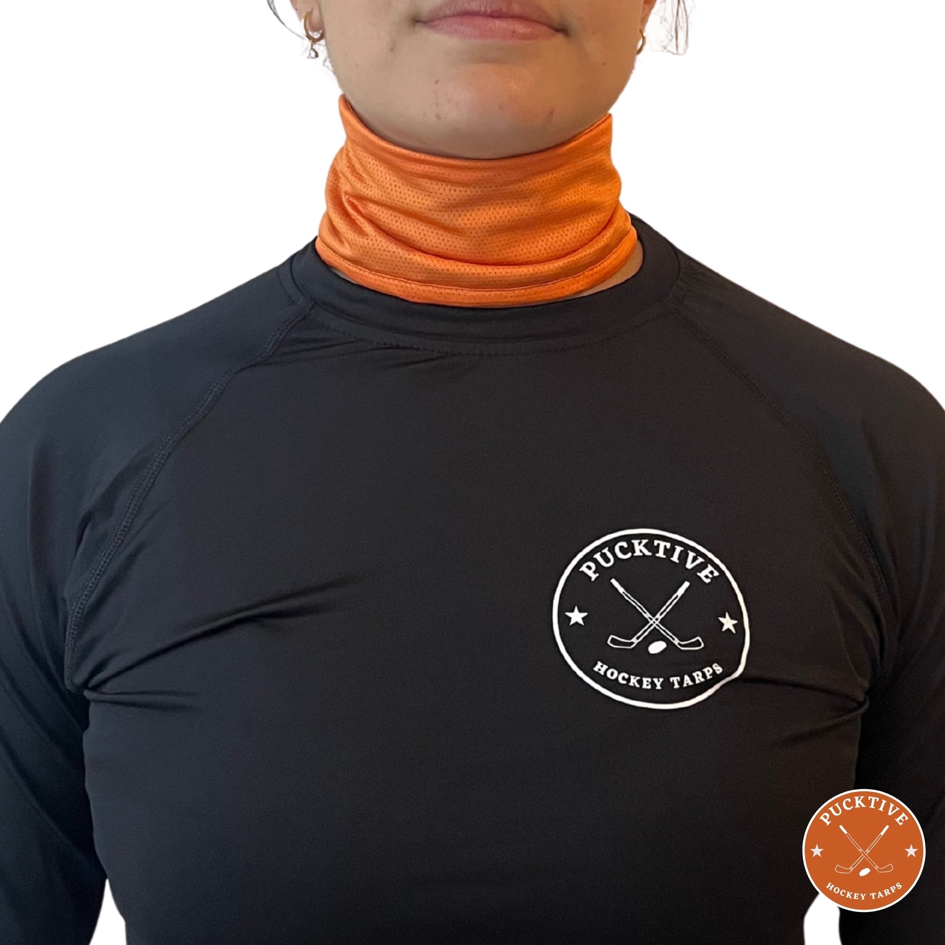 Female hockey player wearing orange Pucktive cut-resistant neck guard.