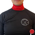 Female hockey player wearing red Pucktive cut-resistant neck guard.