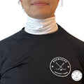 Female hockey player wearing white Pucktive cut-resistant neck guard.