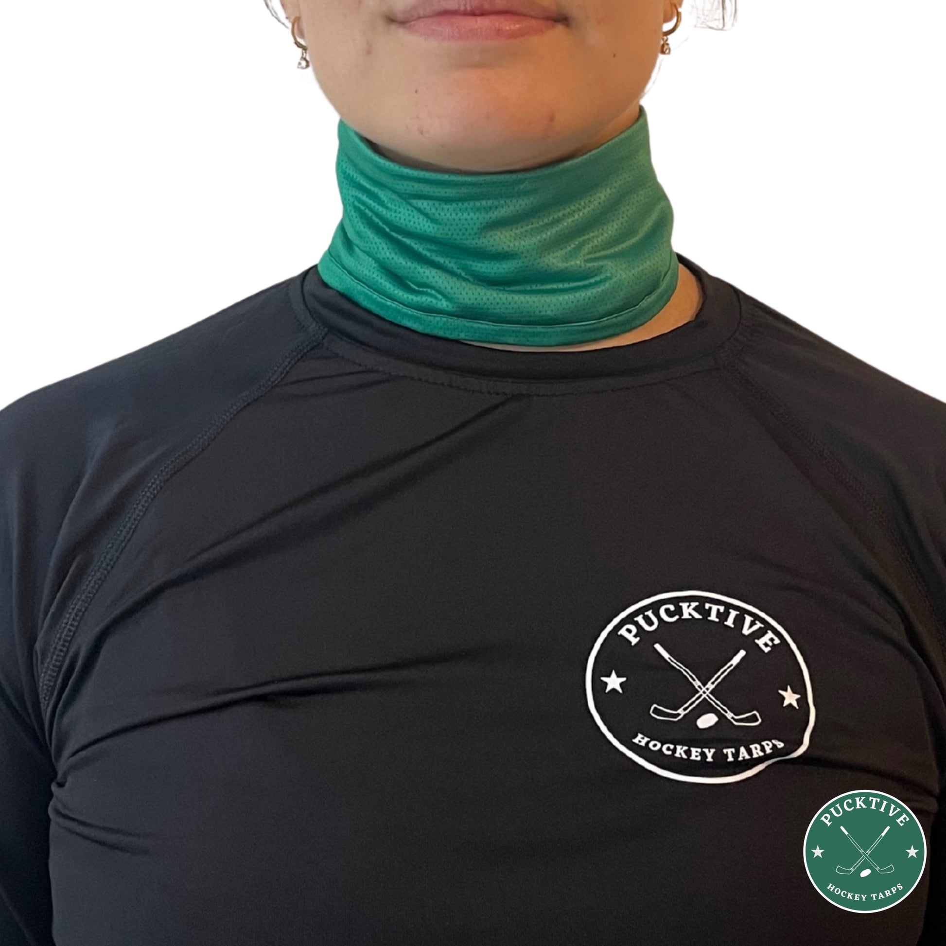 Female hockey player wearing green Pucktive cut-resistant neck guard.