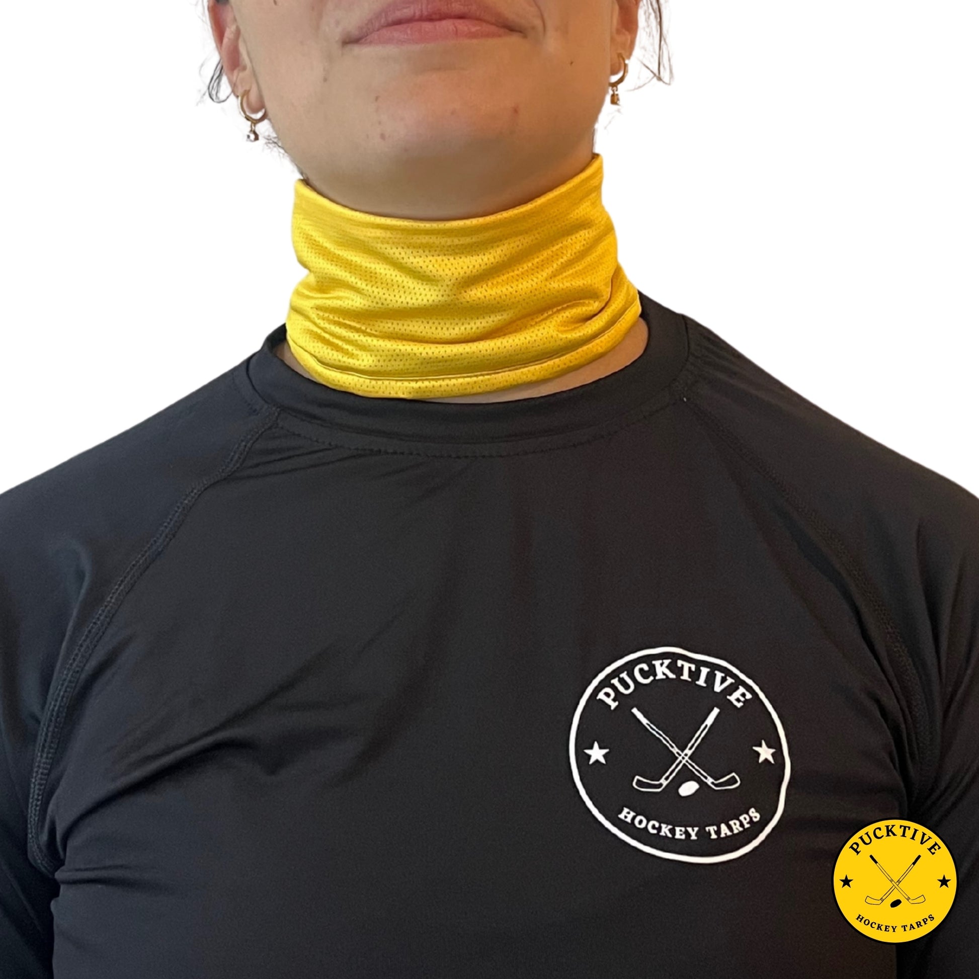 Female hockey player wearing yellow Pucktive cut-resistant neck guard.
