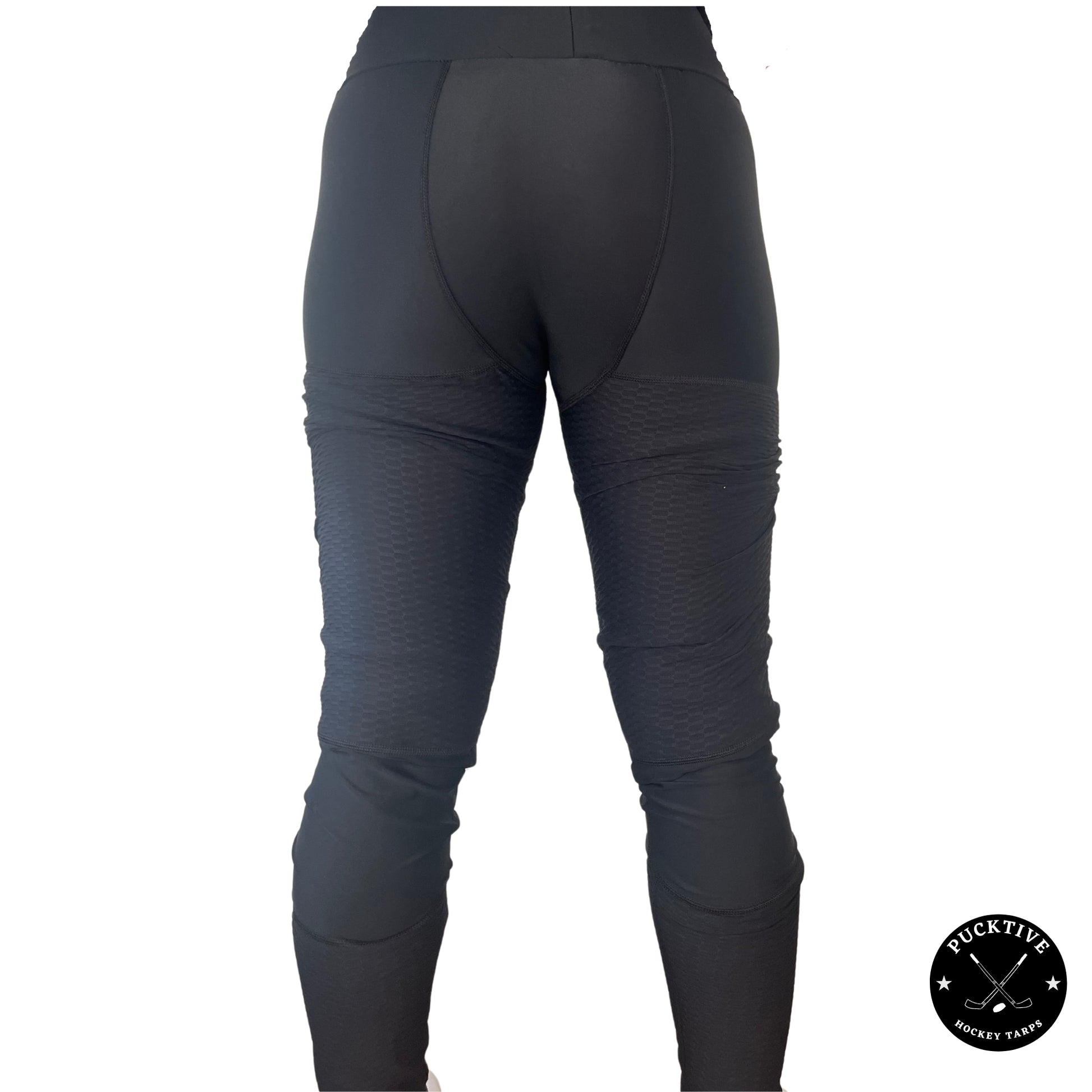 Back view of Girl’s Base A2 cut-resistant hockey leggings showing groin, thigh, calf, and Achilles coverage.