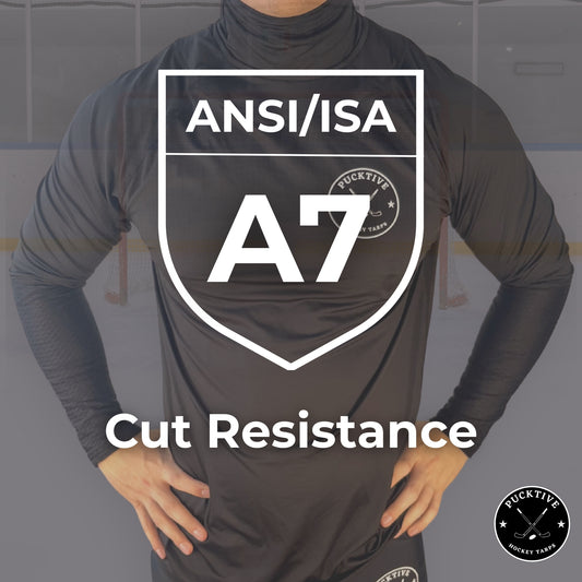 Person wearing a black long-sleeve shirt with ANSI/ISA A7 cut resistance certification logo.